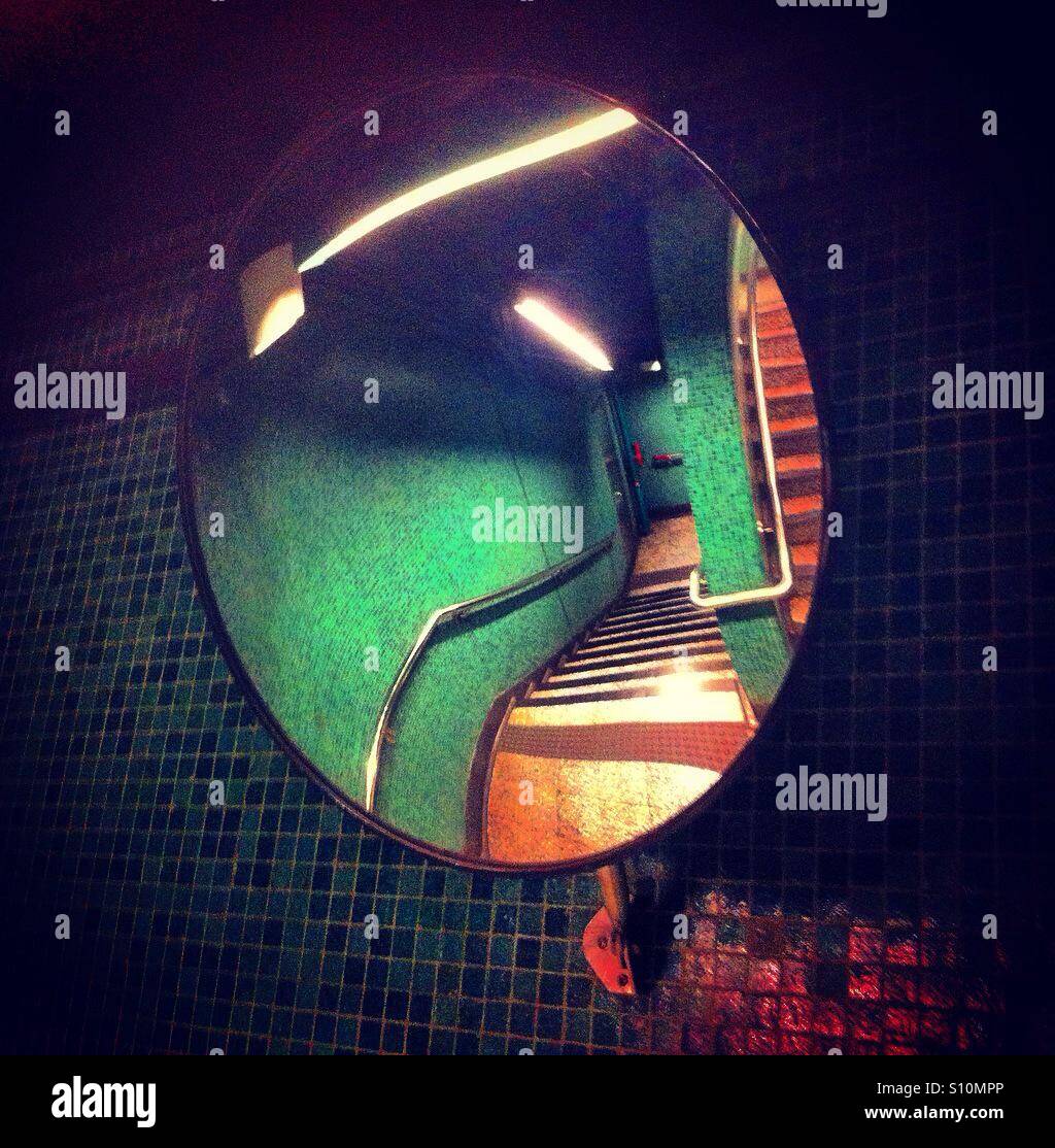 Round mirror in the stairs of the subways - Smartphone Captured Stock Image