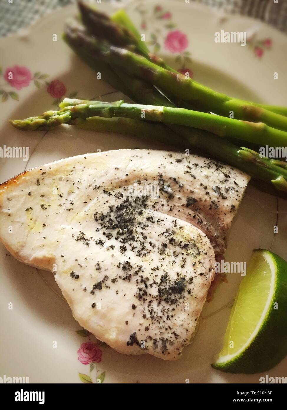 Swordfish steak meal with asparagus - Smartphone Captured Stock Image