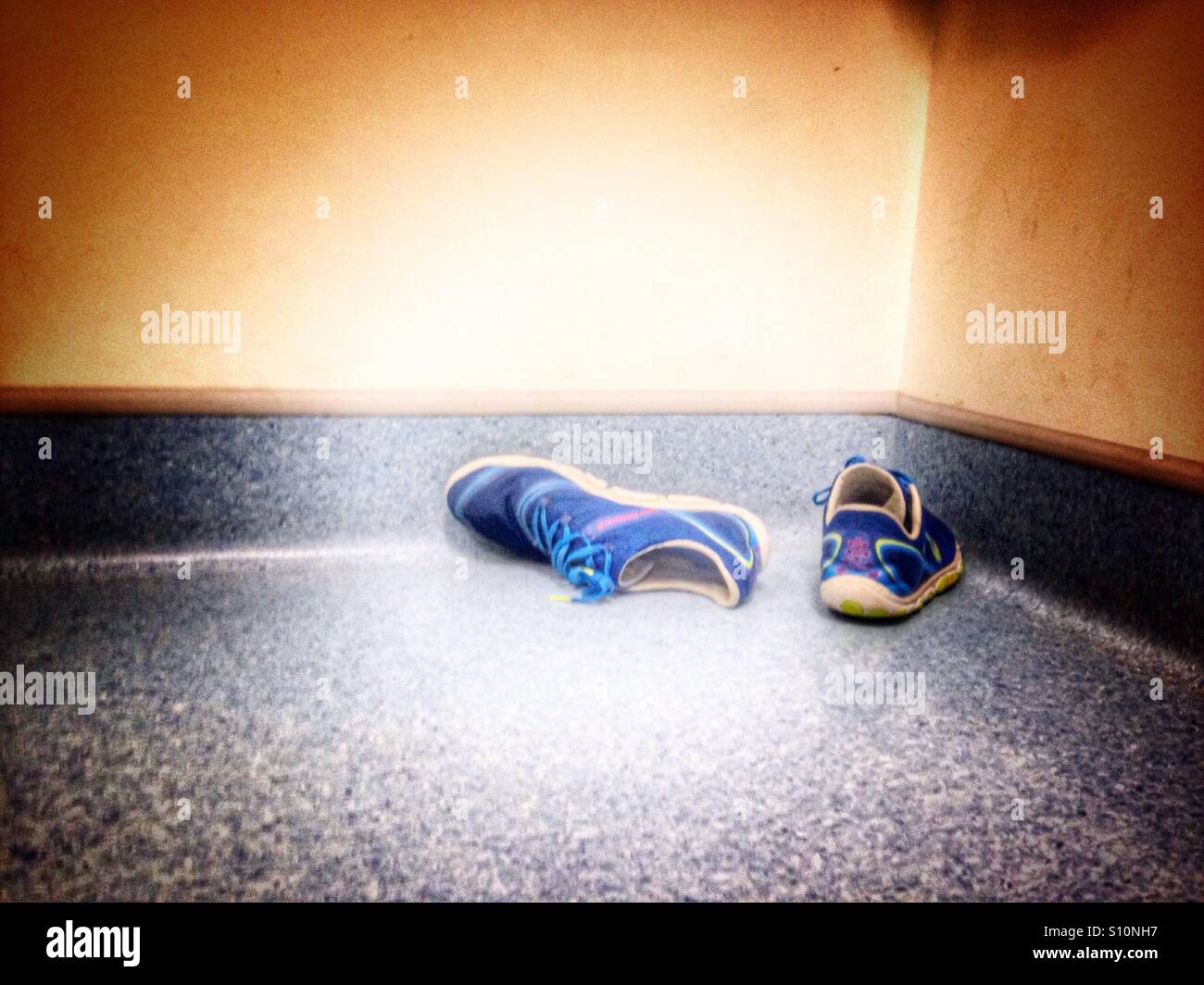 Sneakers on the floor of a gym. - Smartphone Captured Stock Image