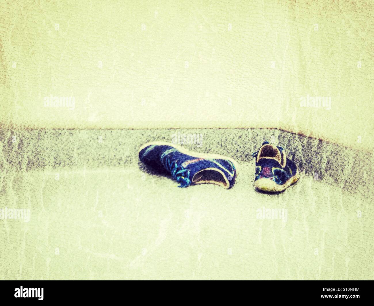 A pair of sneakers on the gym floor. - Smartphone Captured Stock Image