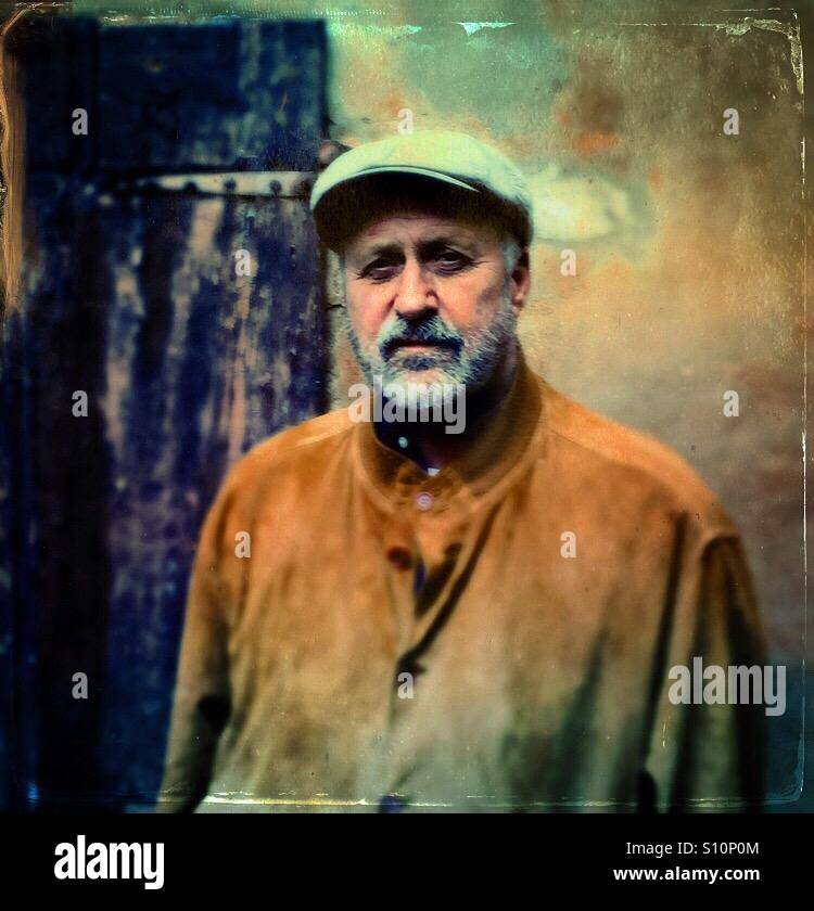 Handsome bearded man in cap and suede jacket - Smartphone Captured Stock Image