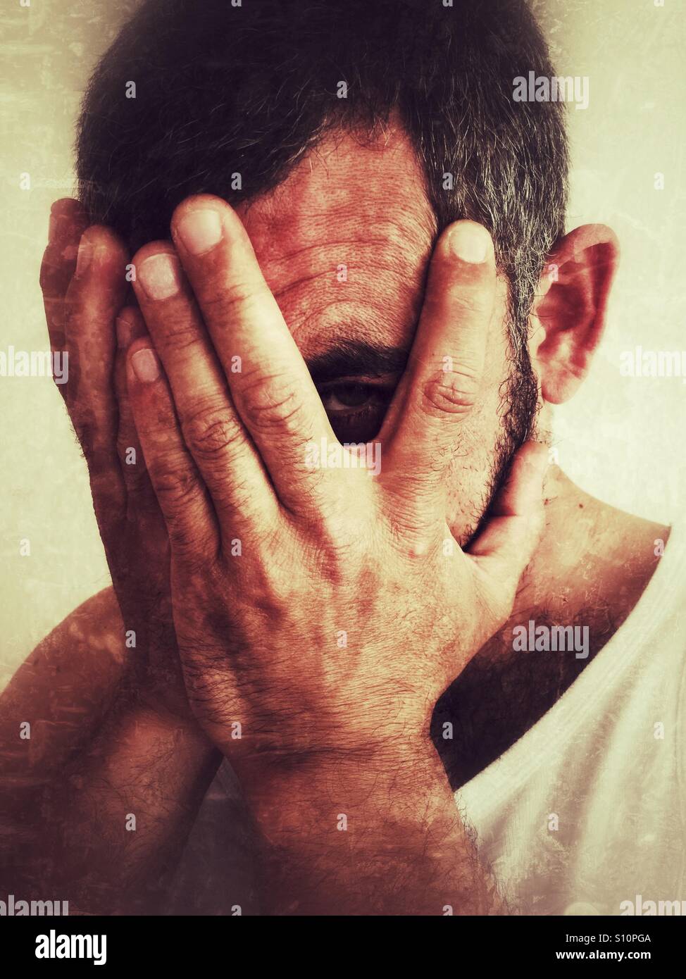 Sinister man hiding his face - Smartphone Captured Stock Image