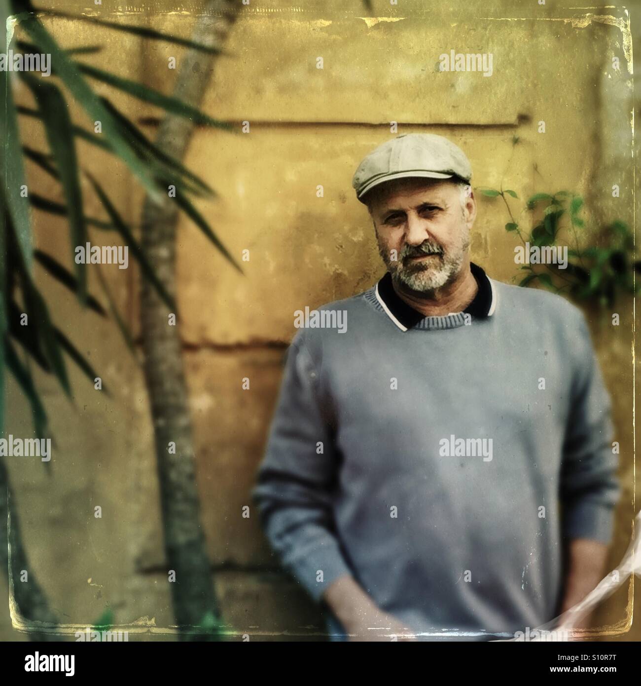 Handsome mature man with beard and cap - Smartphone Captured Stock Image