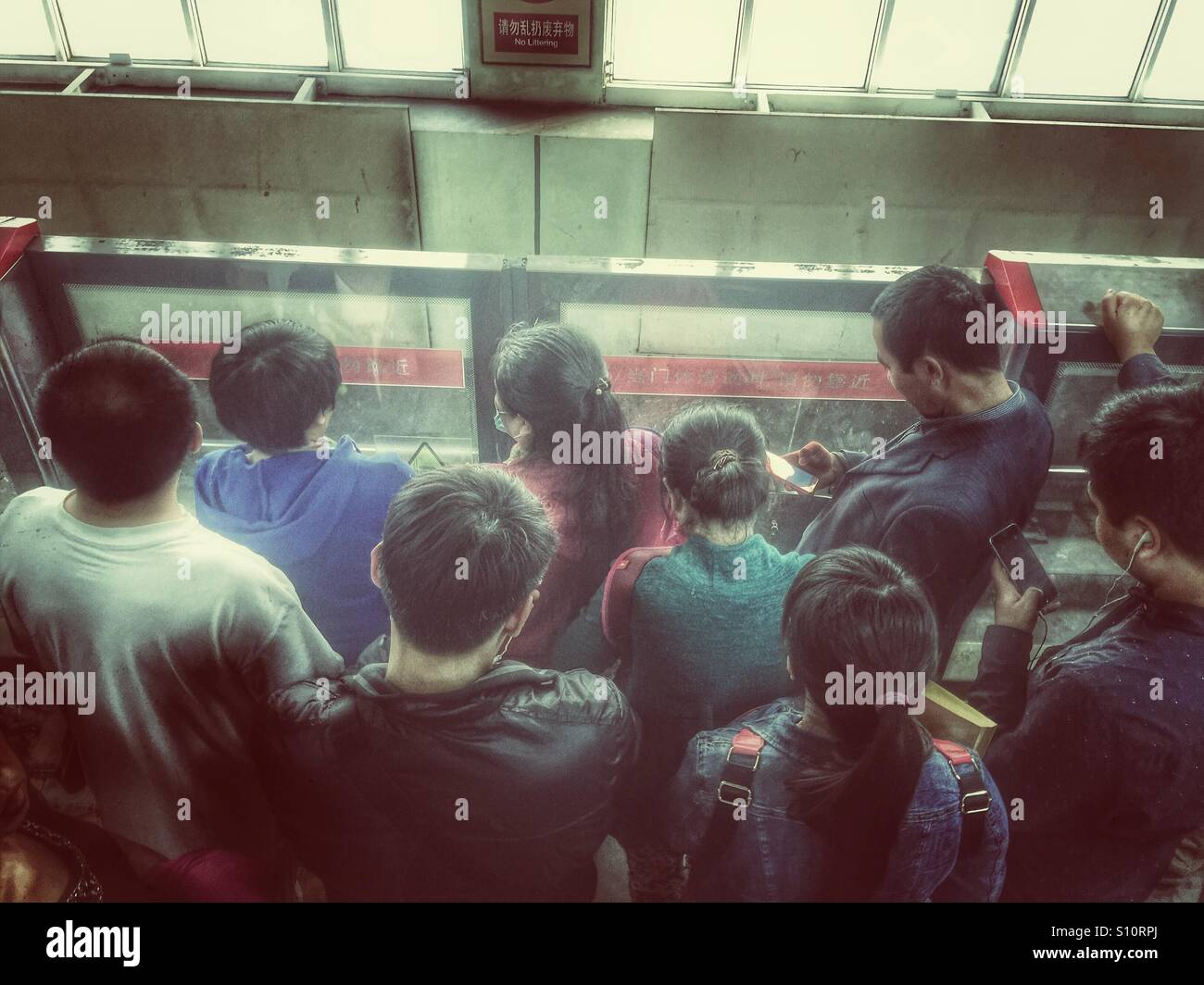 People waiting the metro Beijing China - Smartphone Captured Stock Image