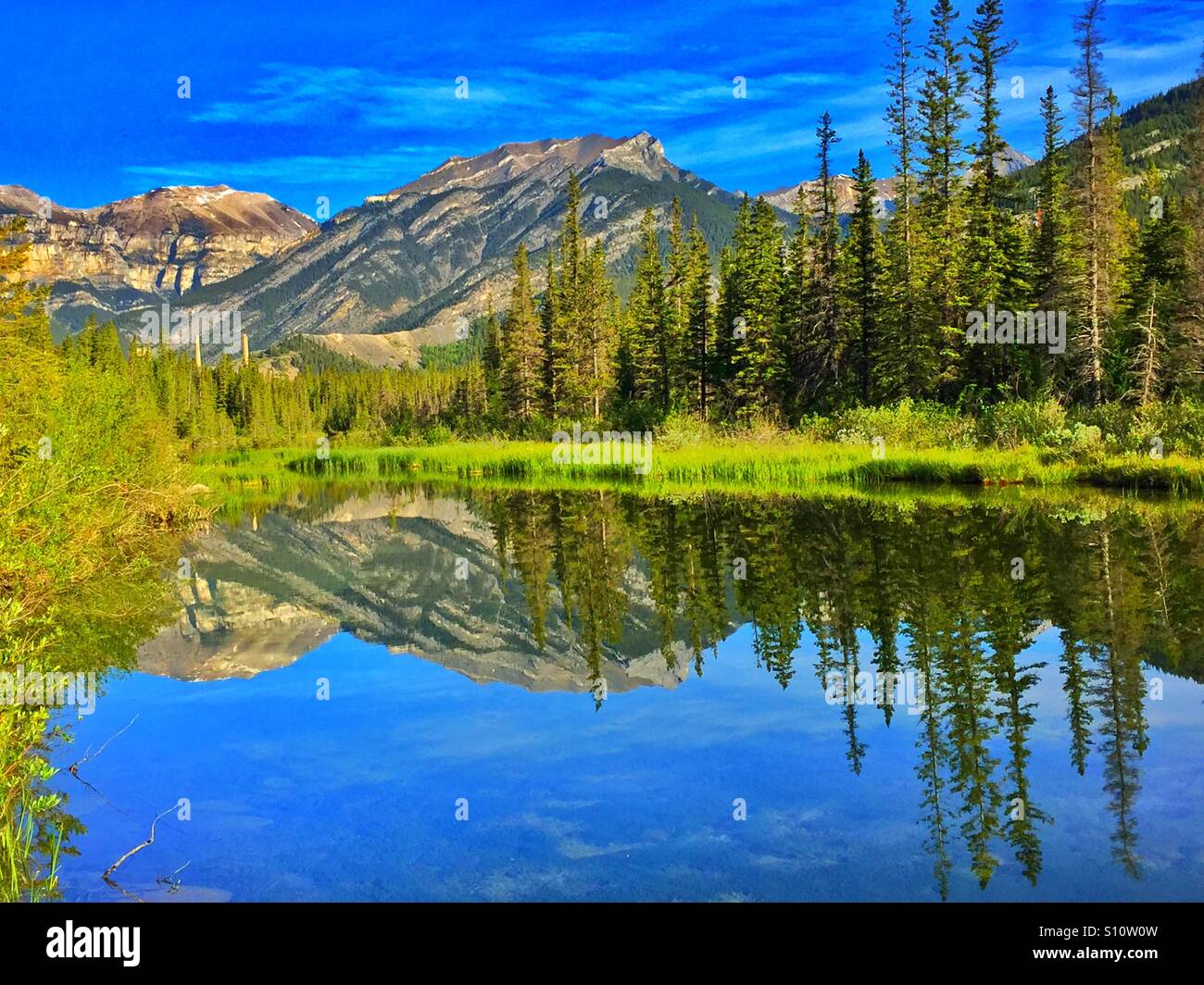 Mountain reflections in a small lake - Smartphone Captured Stock Image