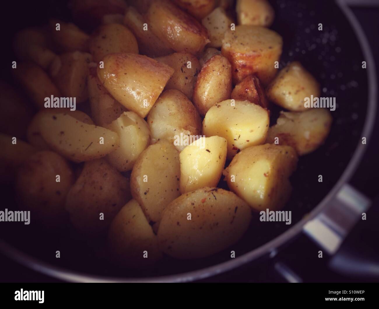Fried potatoes in frying pan - Smartphone Captured Stock Image