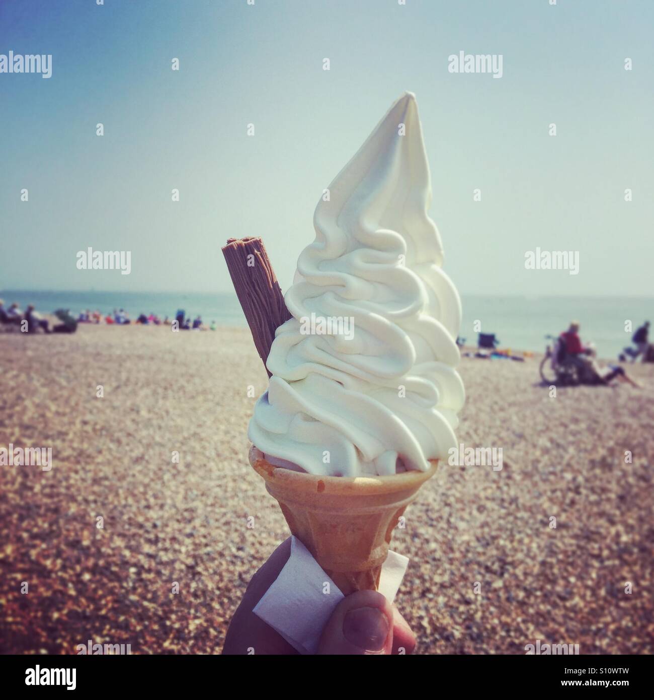 Soft ice cream with a flake in a cone on a beach - Smartphone Captured Stock Image Soft ice cream with a flake in a cone on a beach - Smartphone Captured Stock Image