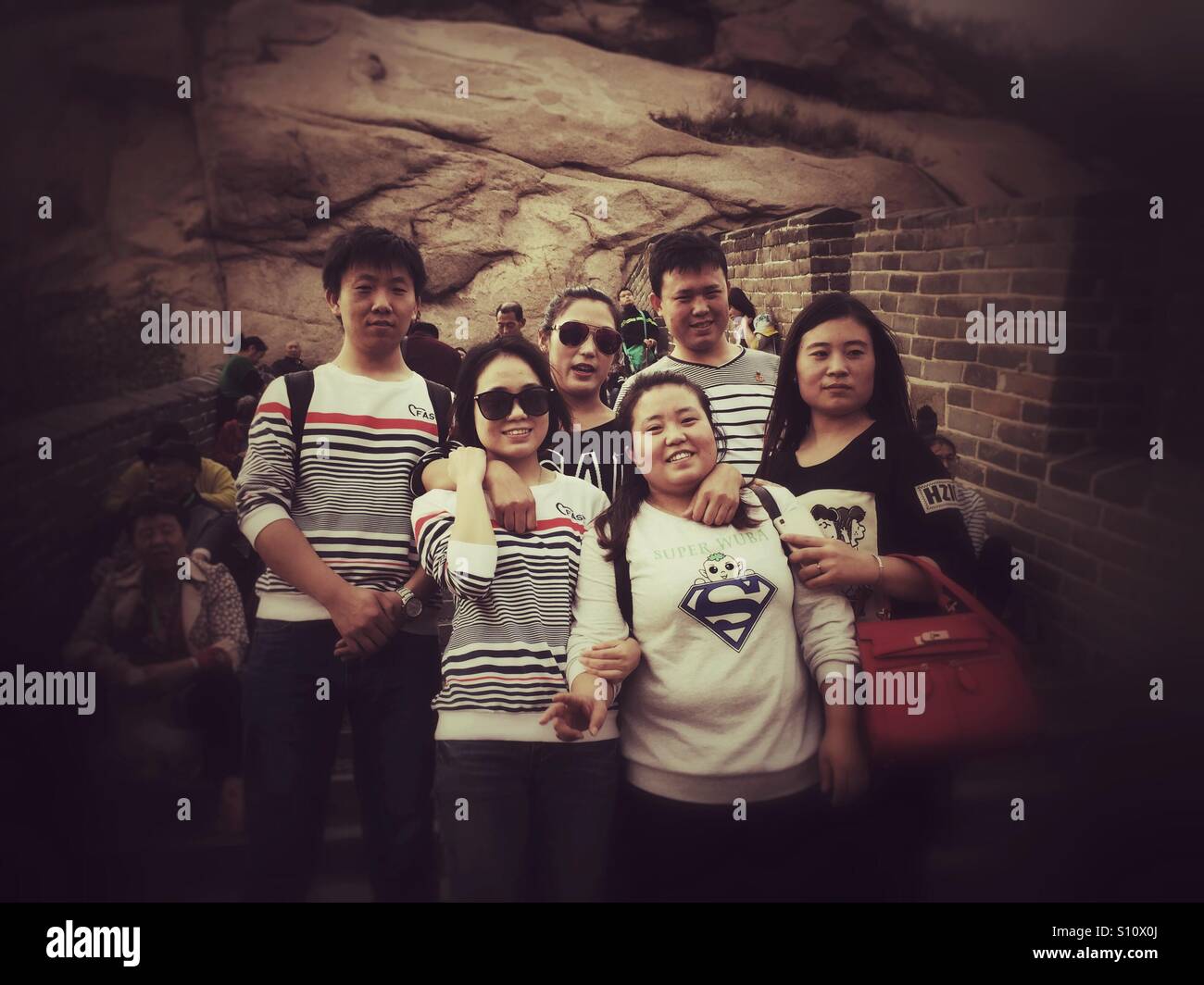 Happy Chinese young friends on the Great wall of China - Smartphone Captured Stock Image