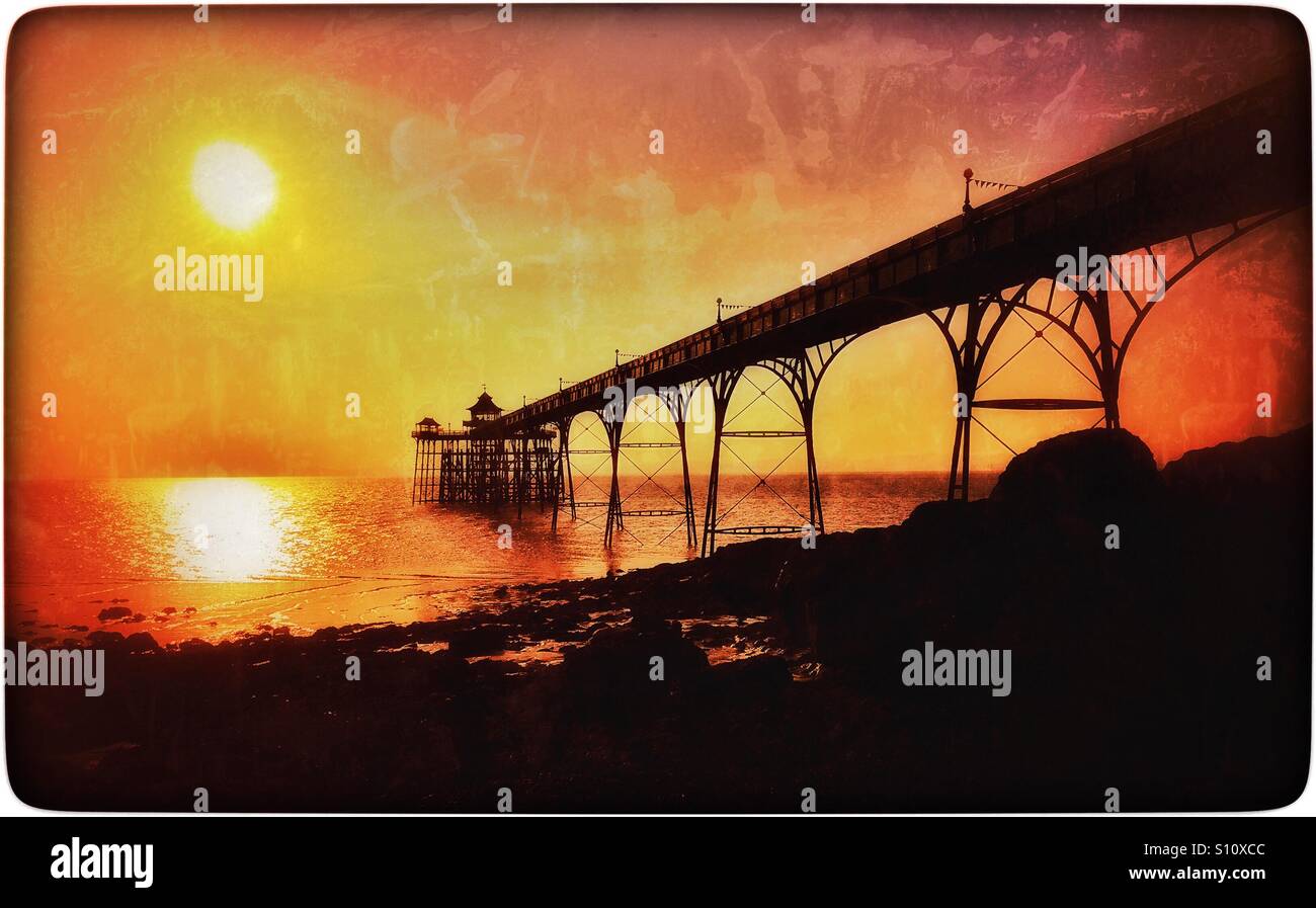 A Sunset view of the Grade One Listed Clevedon Pier in Somerset, England. Construction of The Pier was completed in 1869. It was used by Paddle Steamer visitors from Devon & Wales. © COLIN HOSKINS. - Smartphone Captured Stock Image