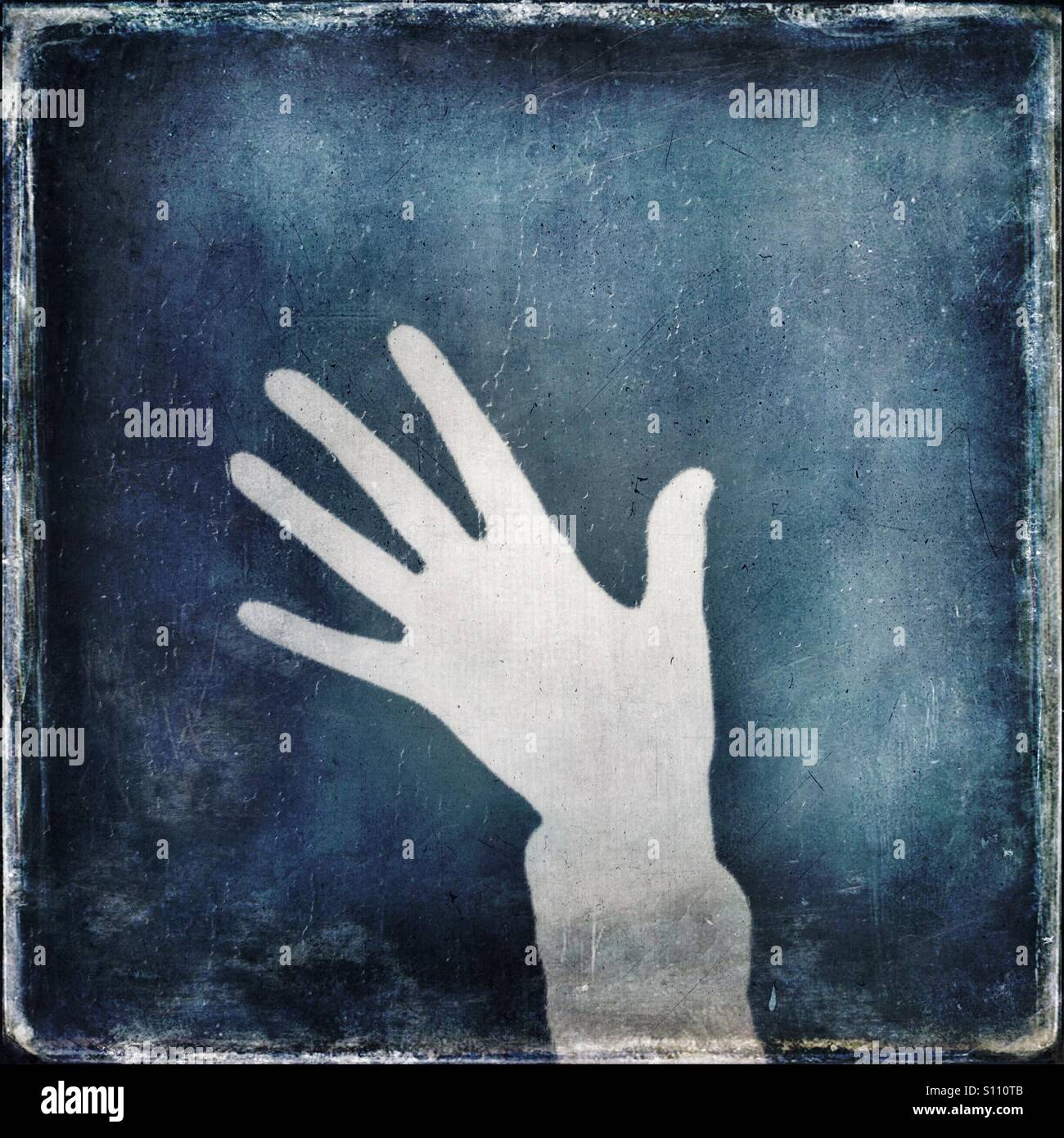 Shadow of a hand showing five fingers - Smartphone Captured Stock Image