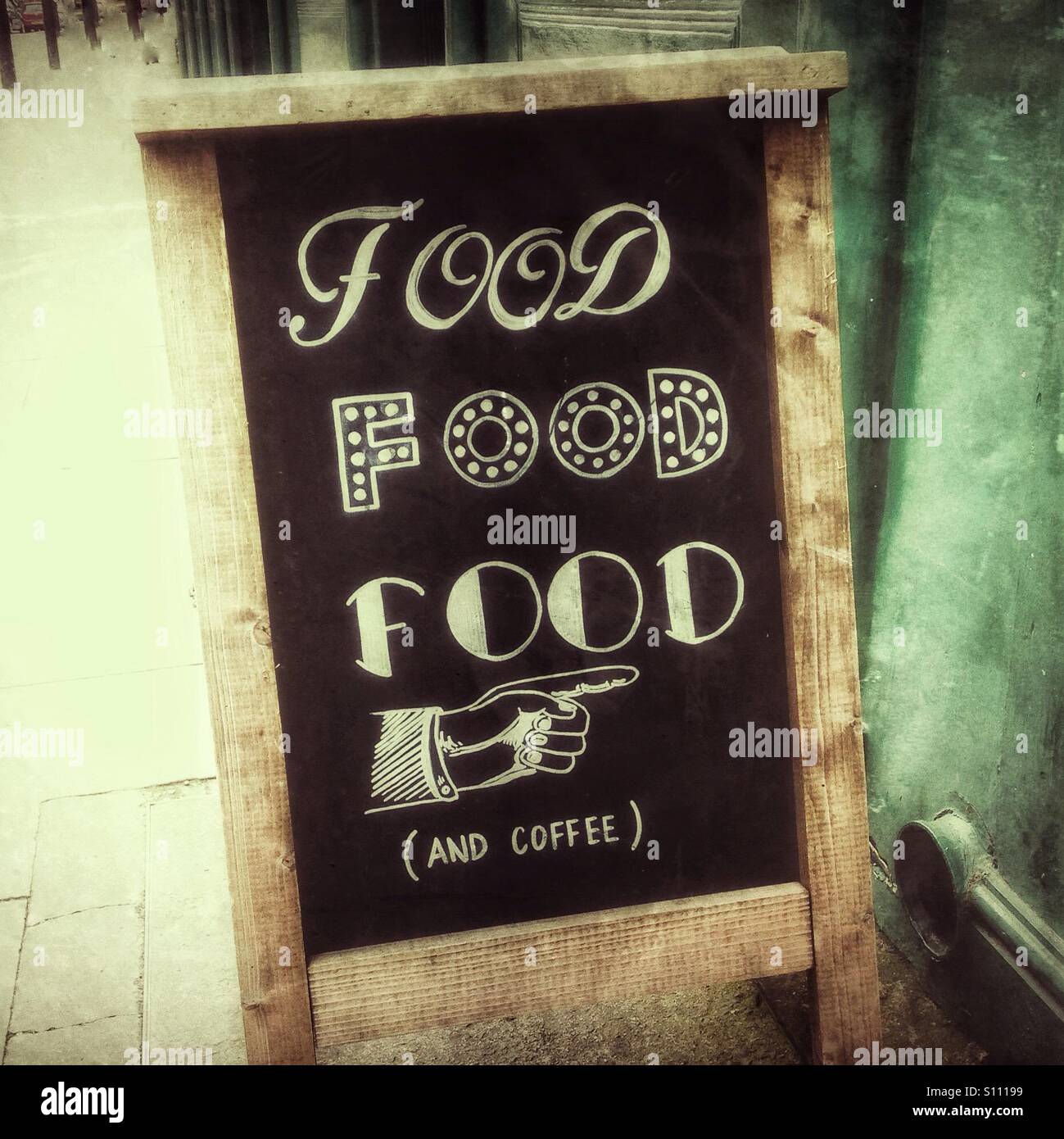 Handwritten A-frame blackboard outside cafe advertising food Stock Photo