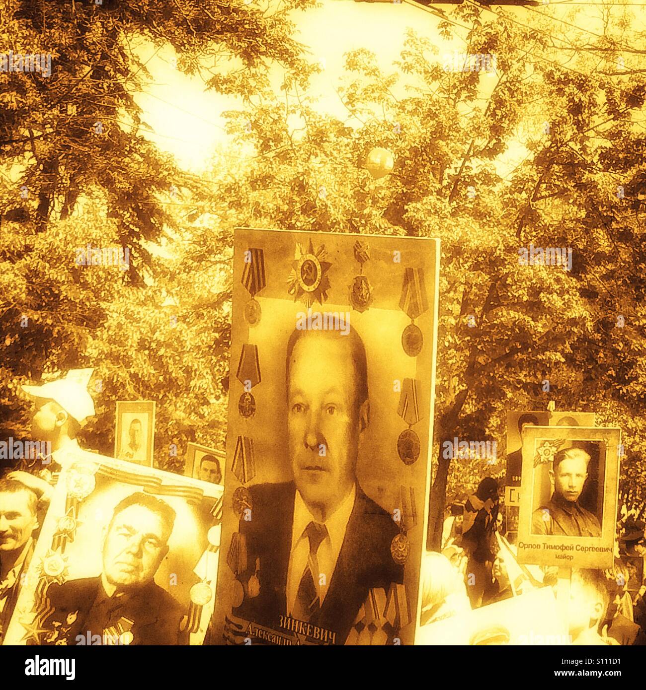 Placards with photos of Russian 2nd World War dead at a May 9th Victory Day parade, Sebastopol, Crimea - Smartphone Captured Stock Image