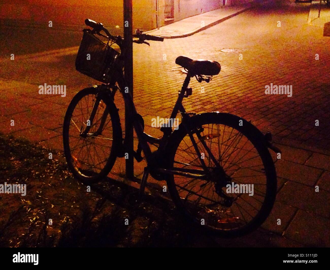 Bicycle in night lights - Smartphone Captured Stock Image