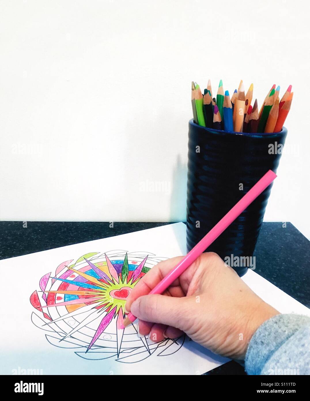 Adult coloring is a recent trend. Concept photo part of a series with copy space. Original design model release - Smartphone Captured Stock Image