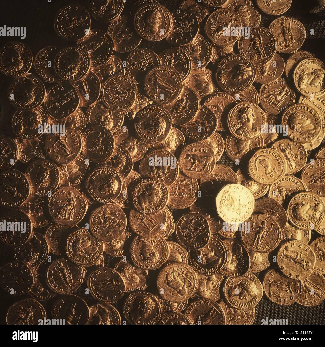 Hoard of gold Roman coins. Stock Photo