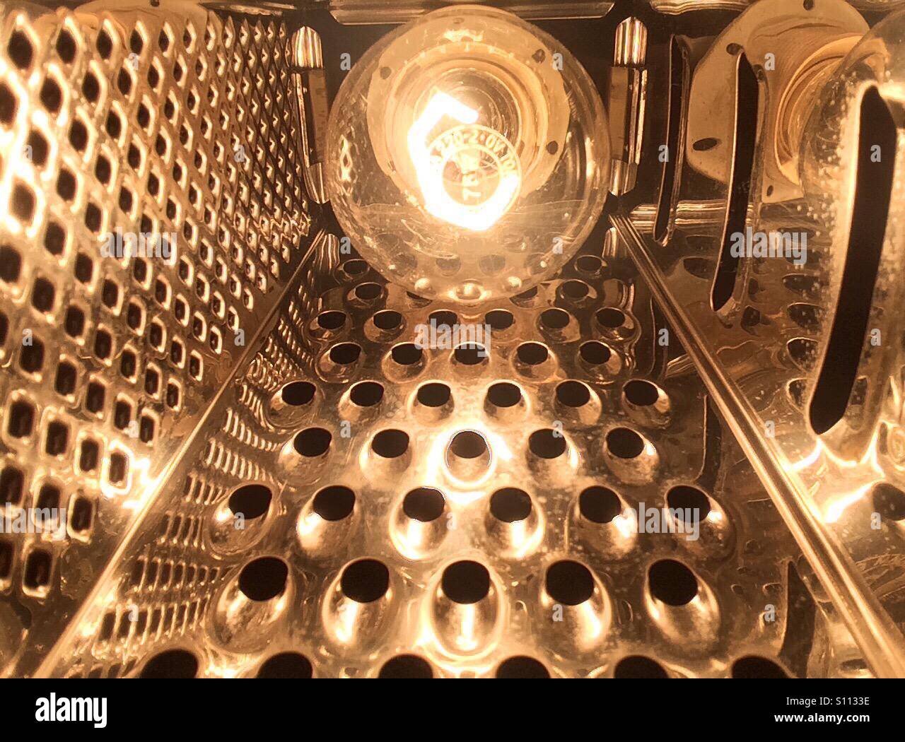 Inside view of cheese grater lamp Stock Photo - Alamy