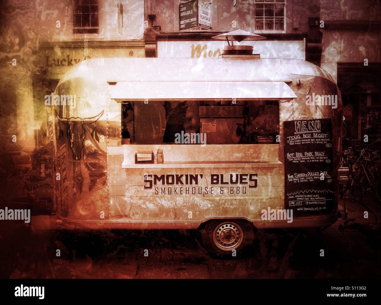 A barbecue van or wagon on city streets with a grunge texture. - Smartphone Captured Stock Image