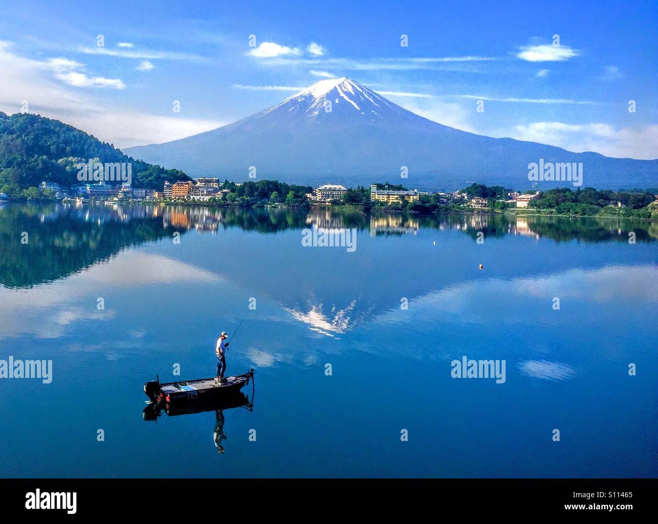 Boat in the lake with Mount Fuji in background Stock Photo - Alamy