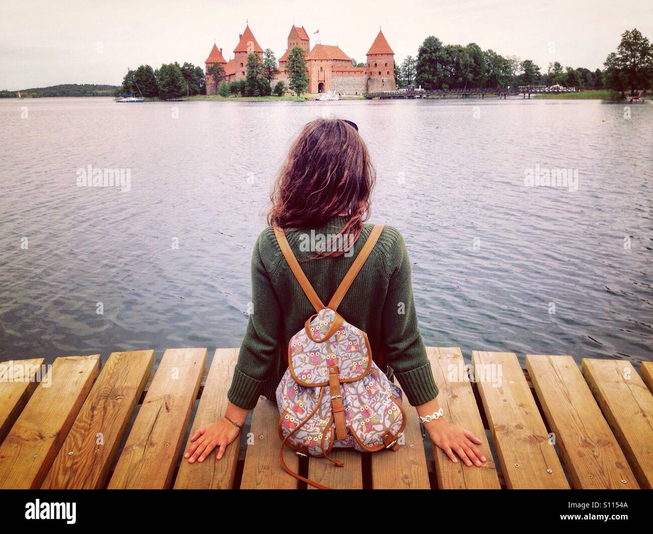 Girl looking at Trakai castle - Smartphone Captured Stock Image