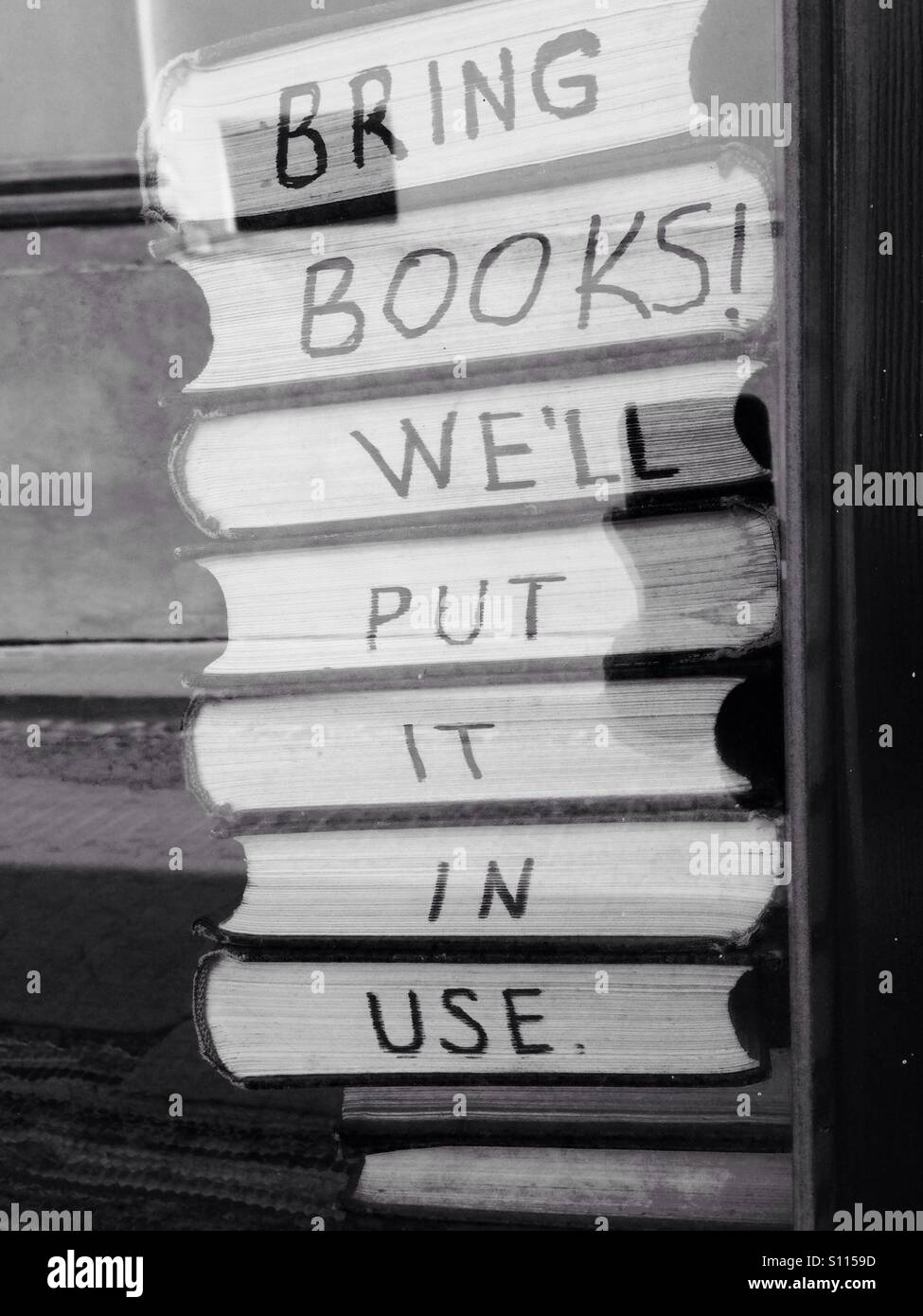 Bring books, we will put it in use - Smartphone Captured Stock Image