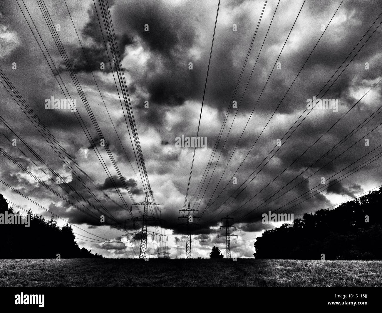 RWE high-voltage electricity lines running through Leichlingen, North Rhine-Westphalia, Germany. - Smartphone Captured Stock Image