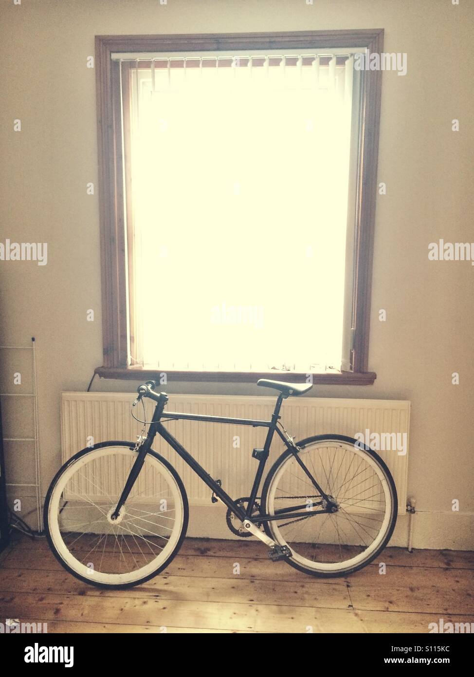 Fixie bike inside an urban home Stock Photo
