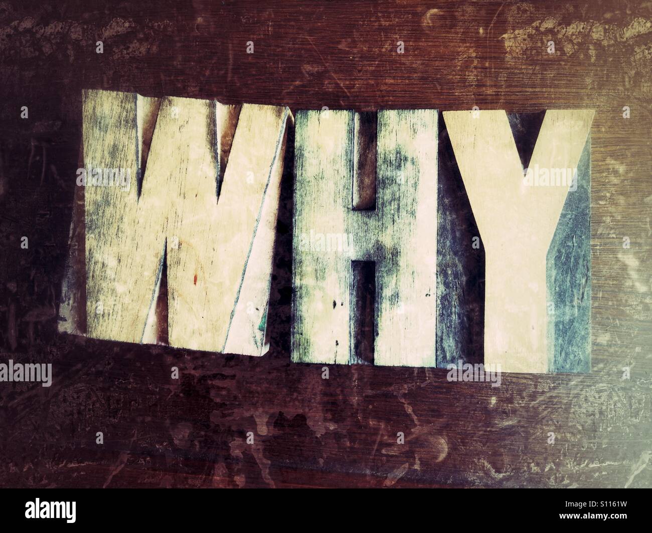 The word why in old wood type - Smartphone Captured Stock Image