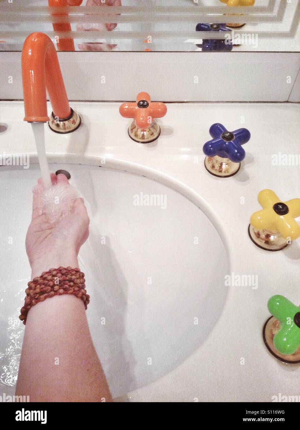 Woman washing hand - Smartphone Captured Stock Image