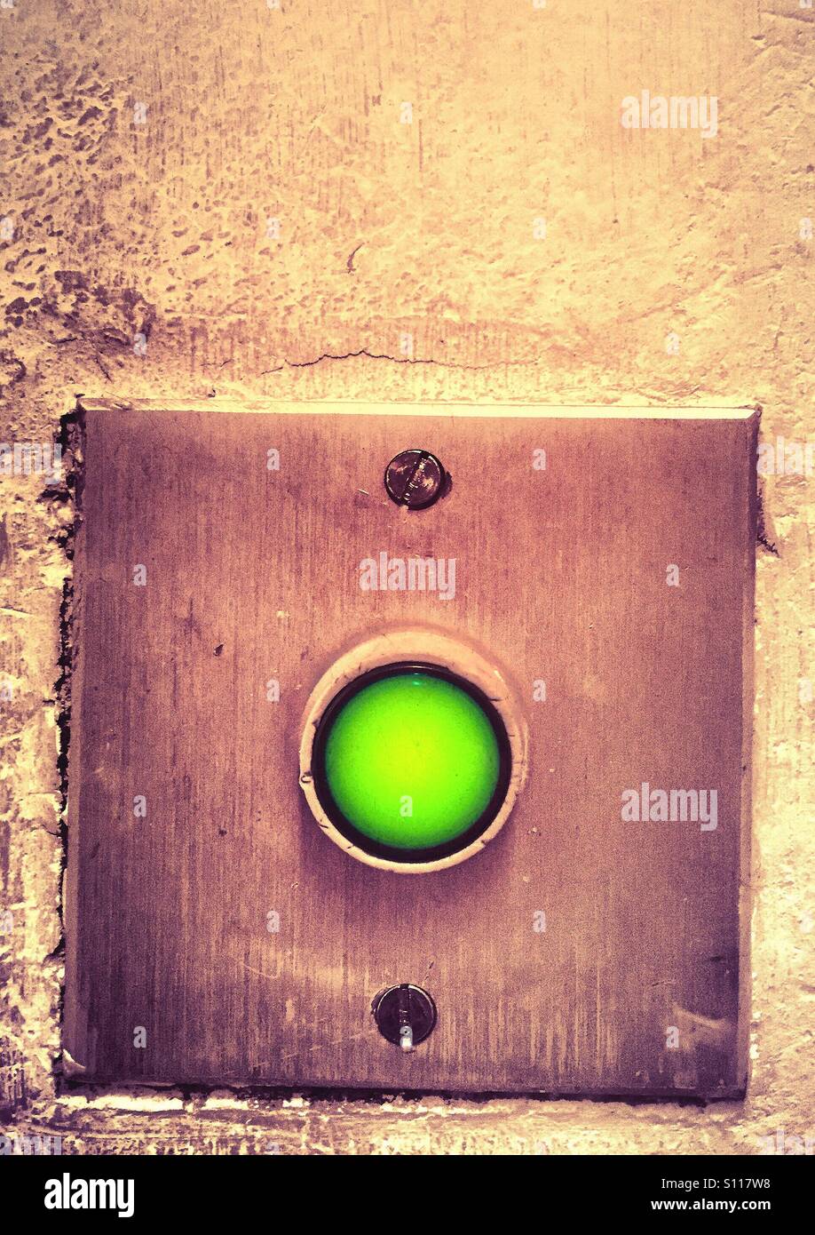 Green button for exit door - Smartphone Captured Stock Image