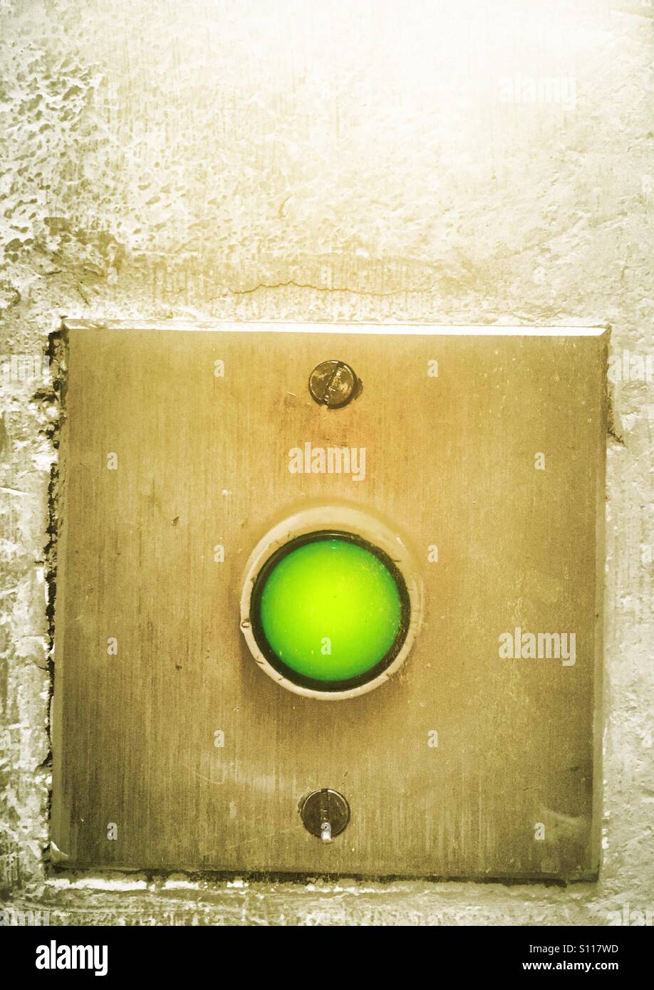 Green button for exit door - Smartphone Captured Stock Image
