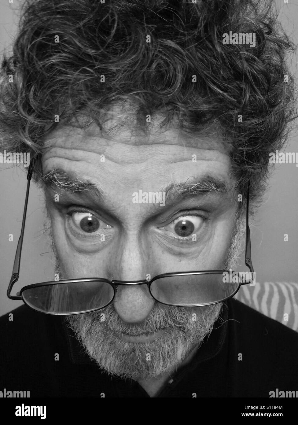 Man, age 65, with expression of surprised confusion, Model Released - Smartphone Captured Stock Image
