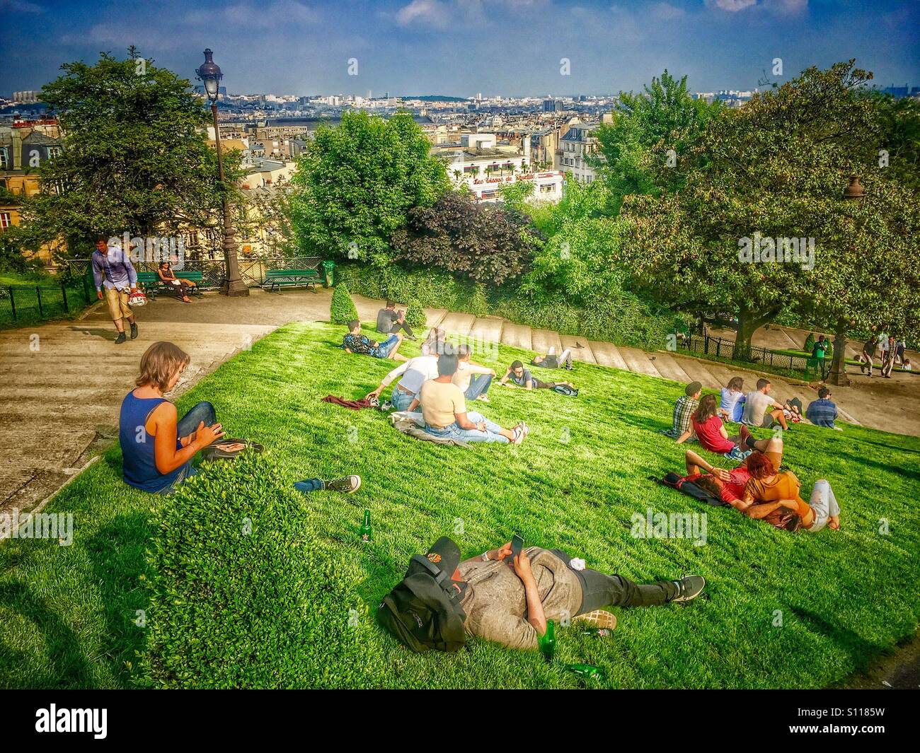 Tourists chilling at Montmartre with a view of Paris Stock Photo