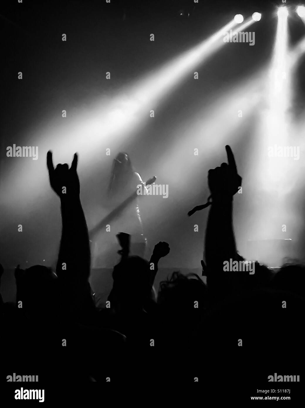 Heavy metal band playing a concert with fans cheering Stock Photo Alamy