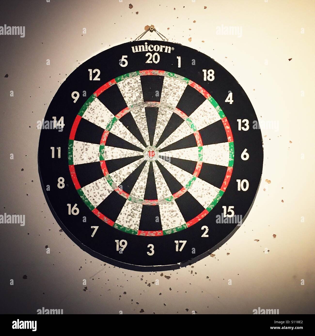 Heavily used dartboard Stock Photo Alamy