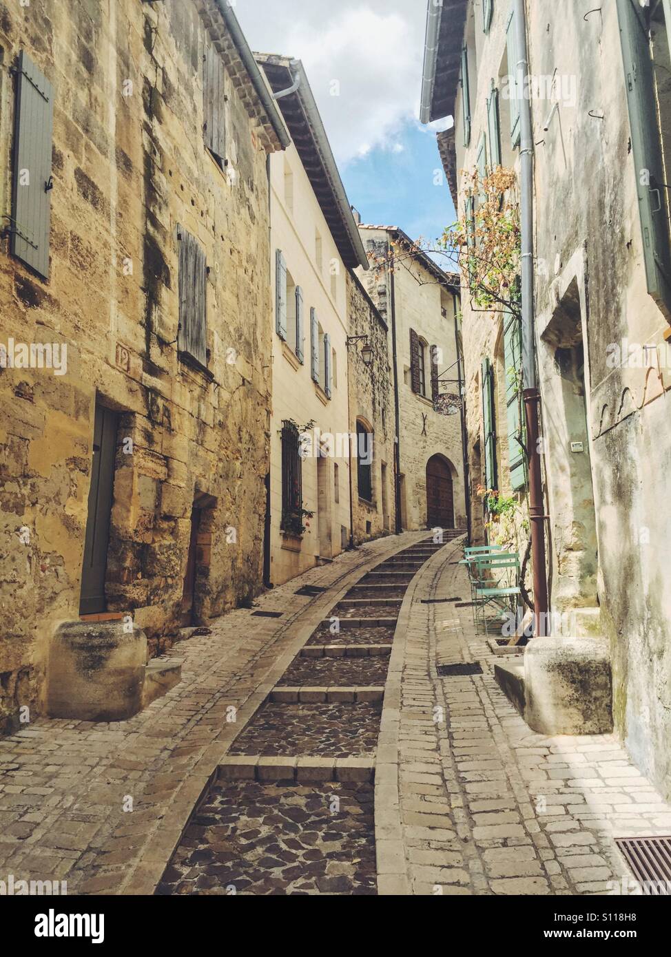 Beautiful windy street in the town of Uzes, Gard region, Languedoc Roussillon, France - Smartphone Captured Stock Image