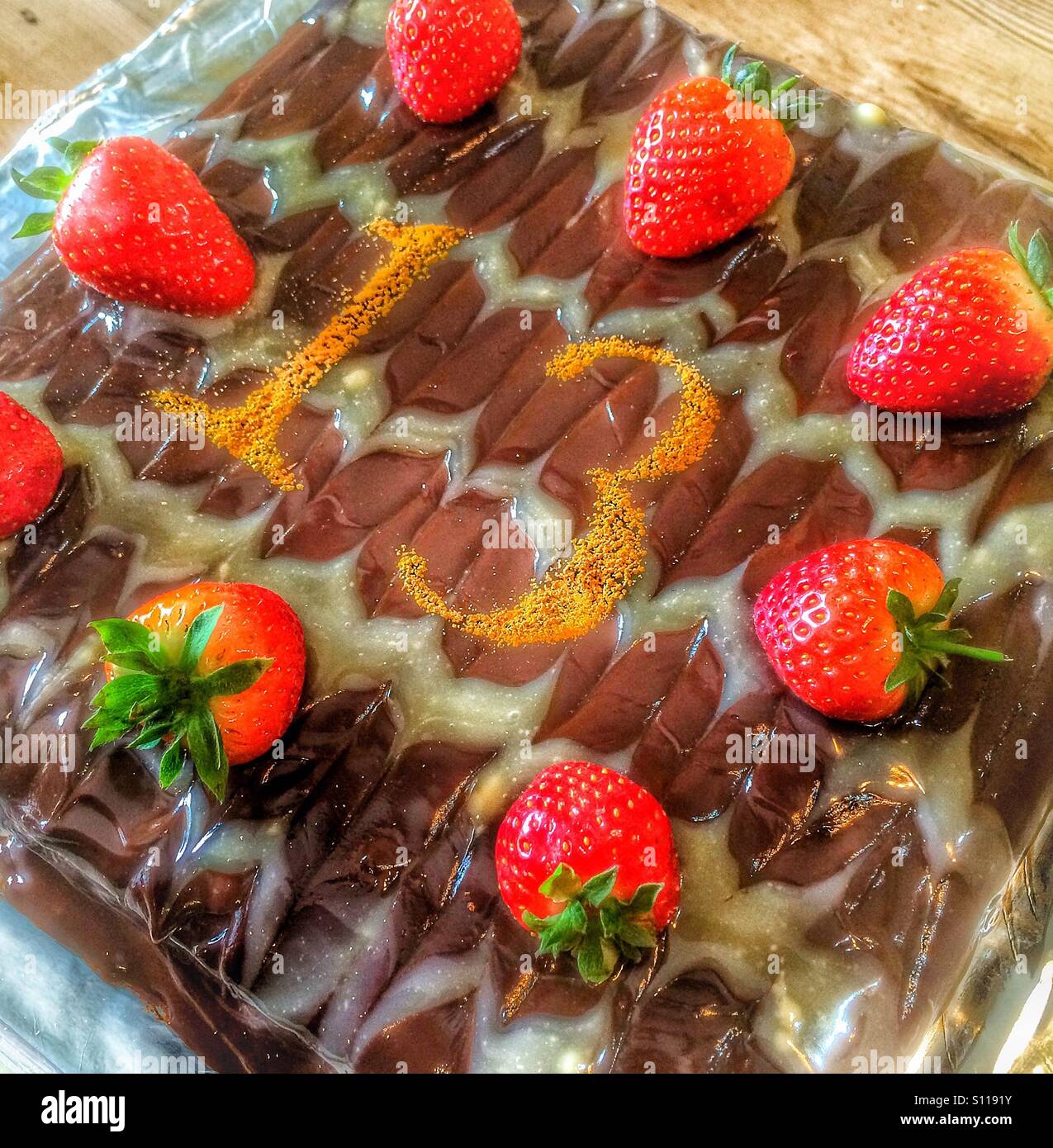 Chocolate and strawberry birthday cake. Stock Photo