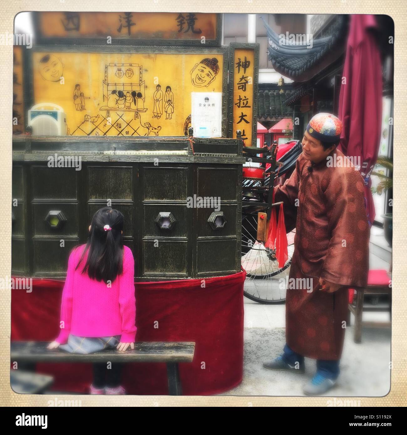 Street vendor and a girl Stock Photo
