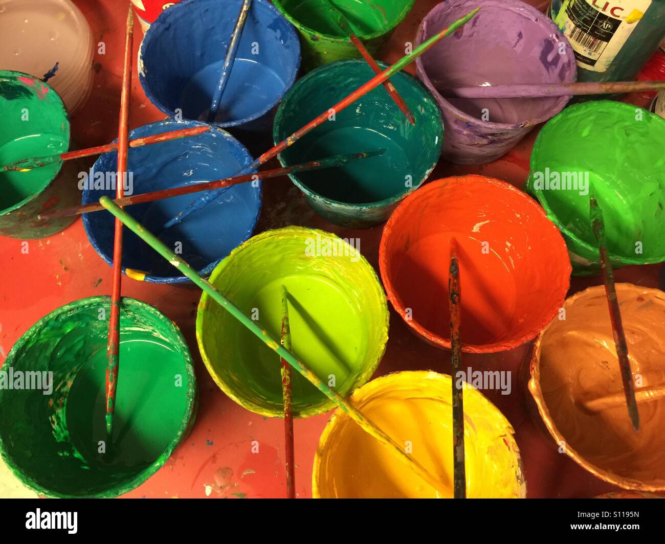 Cups with paints and brushes - Smartphone Captured Stock Image