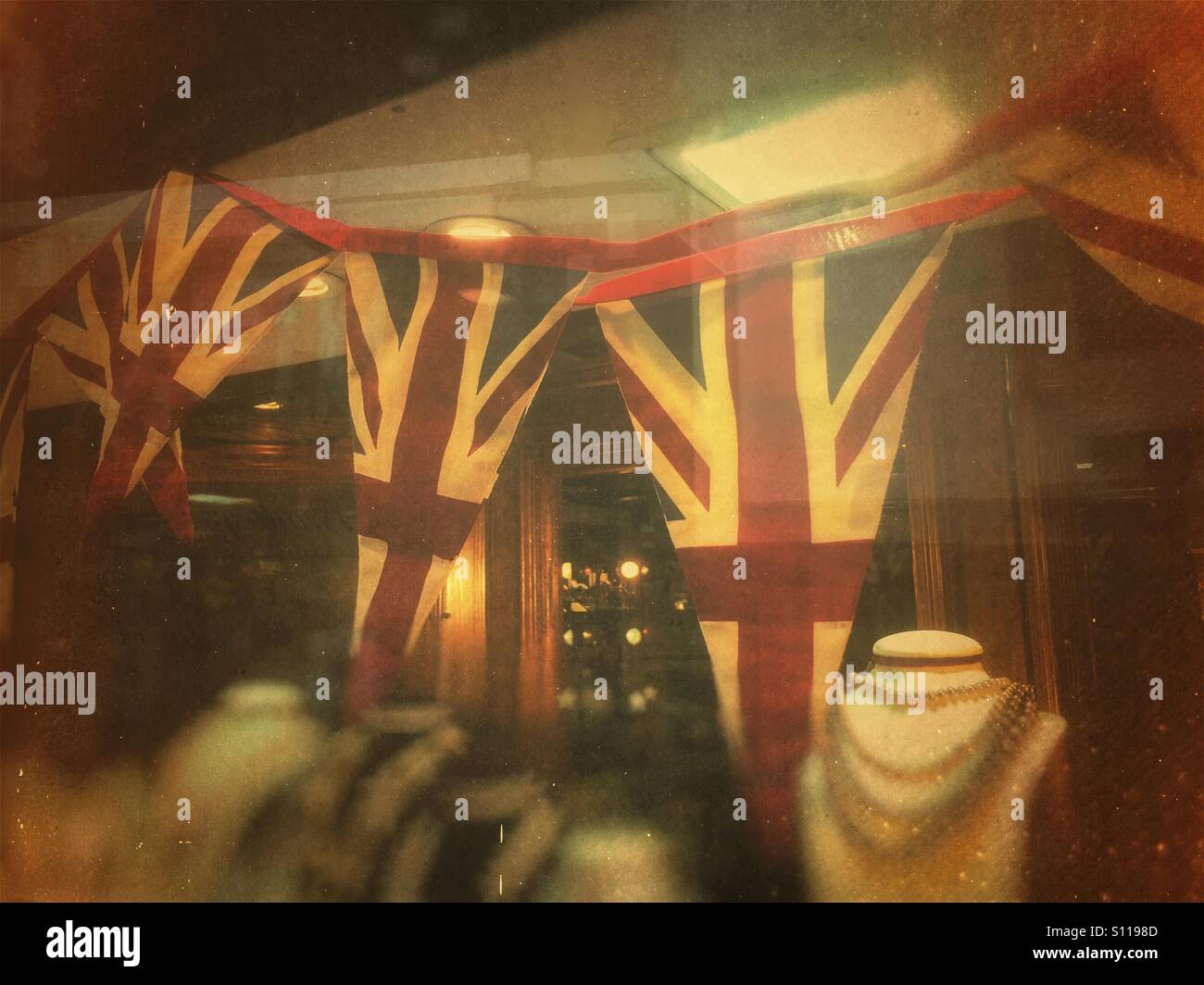 Union Jack flags in shop window England UK - Smartphone Captured Stock Image