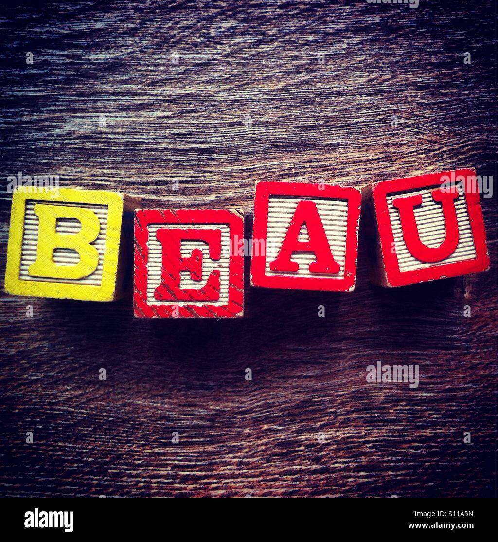 French word BEAU meaning BEAUTIFUL, done with wood blocks alphabet