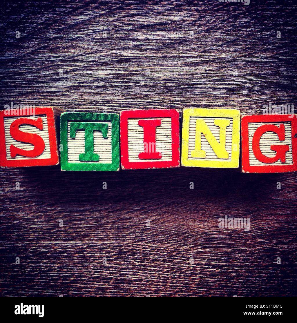 Word STING done with alphabet wood blocks letters - Smartphone Captured Stock Image