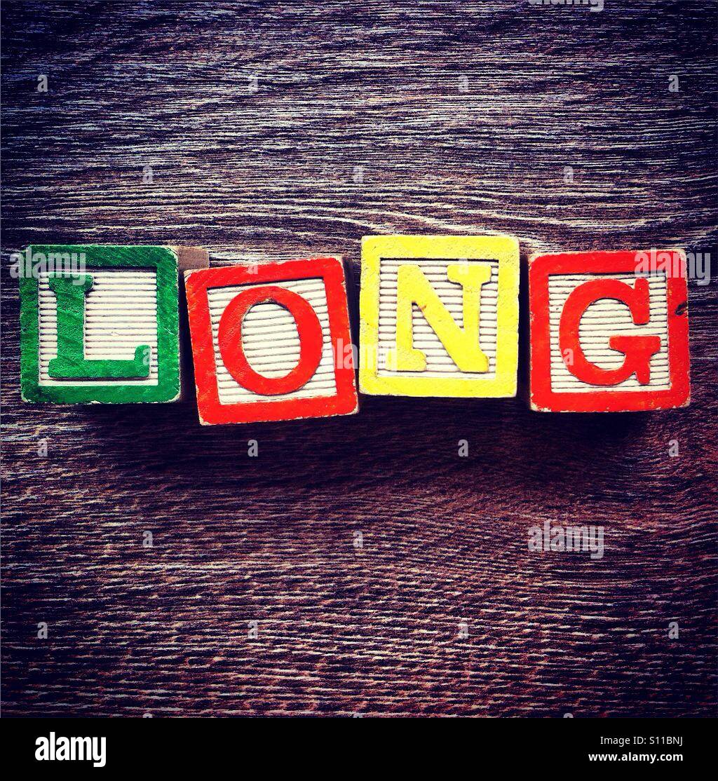 Word LONG done with alphabet wood blocks letters Stock Photo