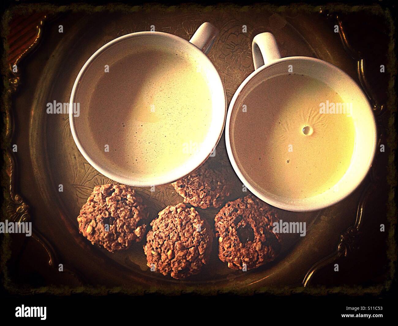 Two cups of milk tea and oat cookies - Smartphone Captured Stock Image