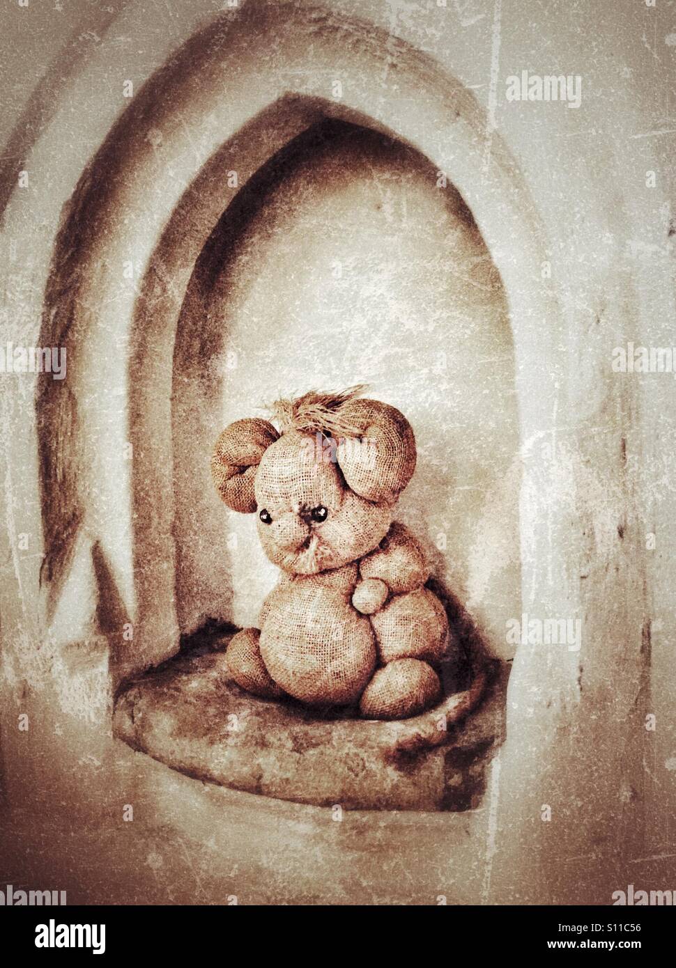 Old toy mouse in a church alcove. - Smartphone Captured Stock Image
