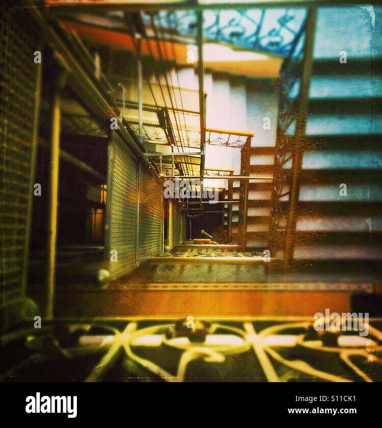 An Escher moment looking down a staircase  and elevator shaft - Smartphone Captured Stock Image