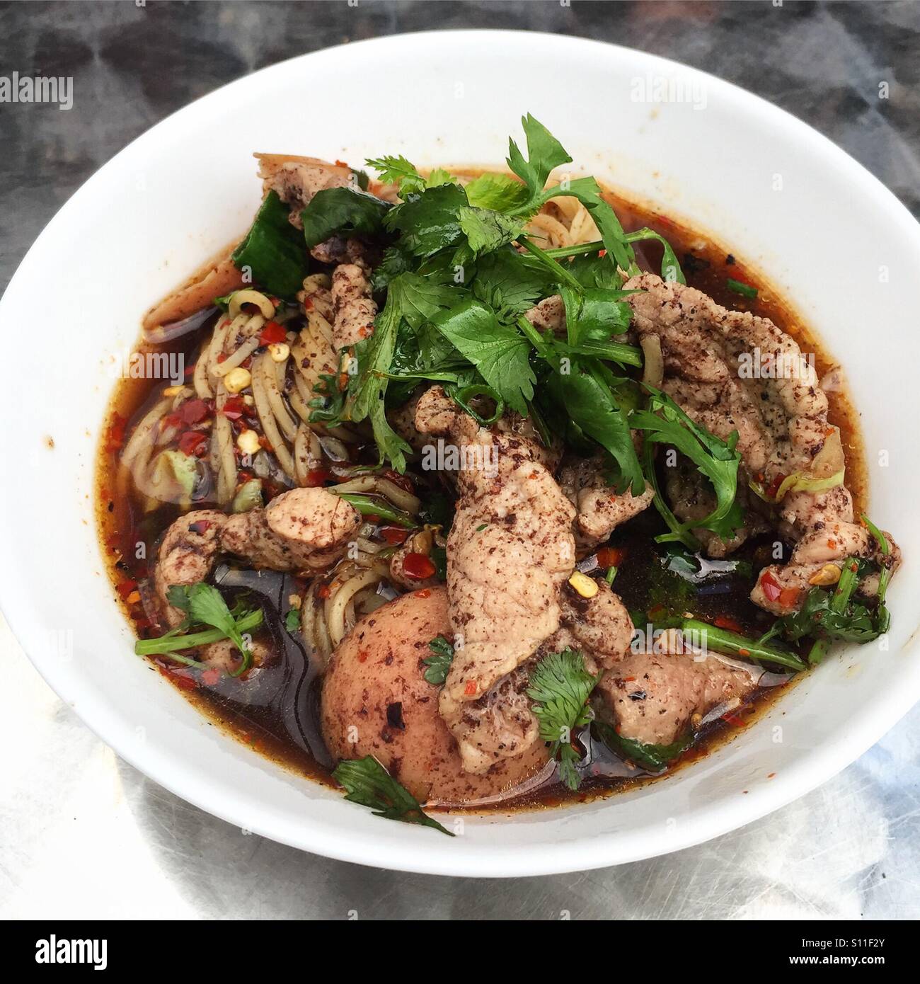 Thai spicy noodle soup Stock Photo - Alamy