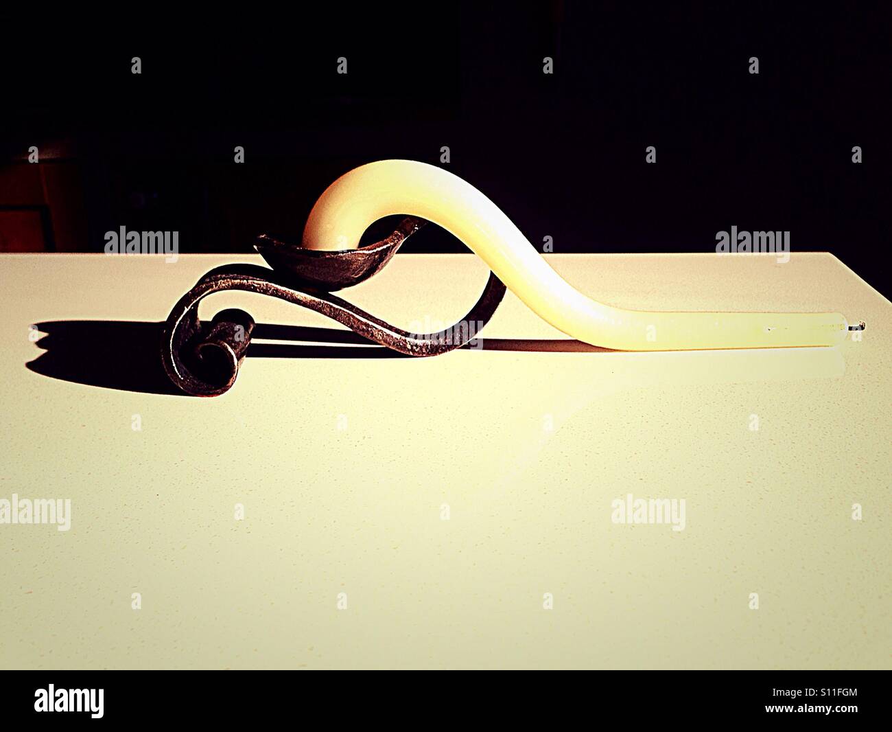 Candle got melted because of hot weather - Smartphone Captured Stock Image