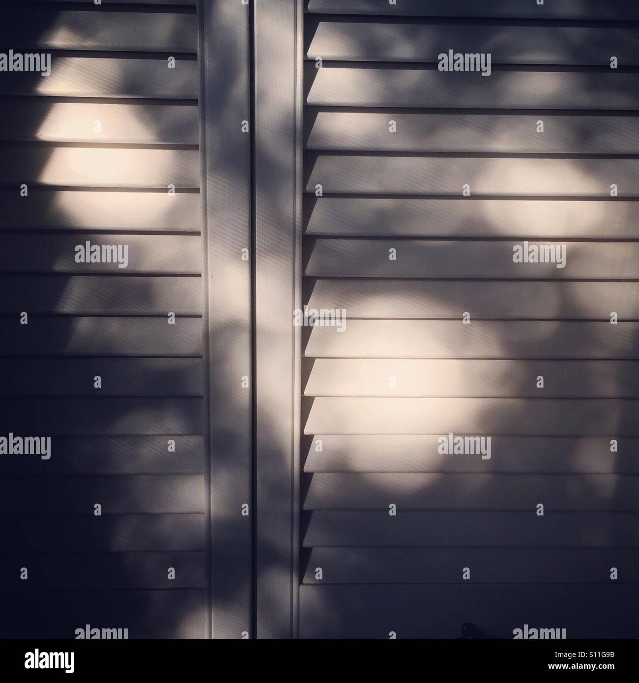 Afternoon shadows on wooden doors - Smartphone Captured Stock Image