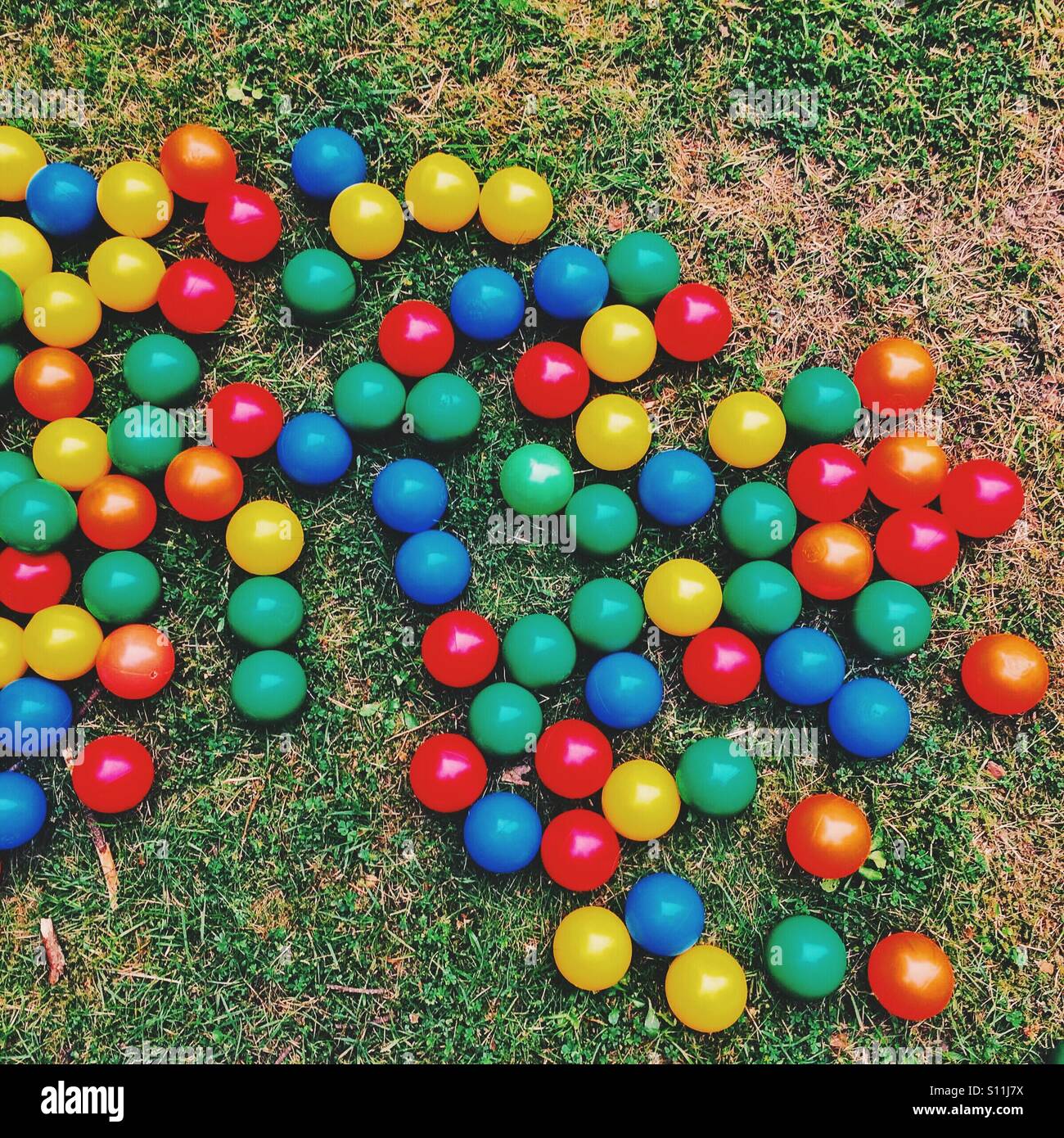 Scattered coloured plastic balls Stock Photo Alamy