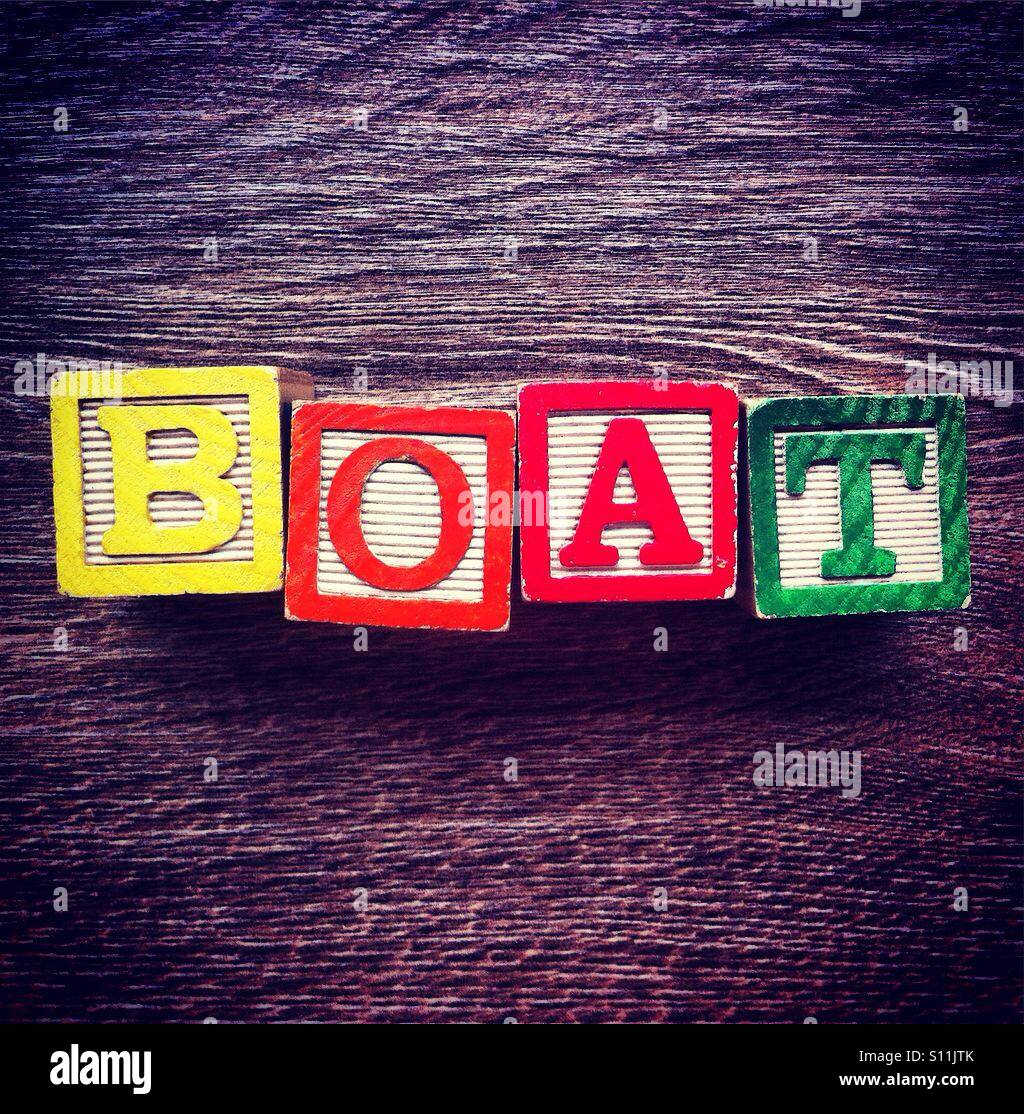 Word BOAT done with alphabet wood blocks letters - Smartphone Captured Stock Image